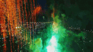 drone flying through fireworks gif